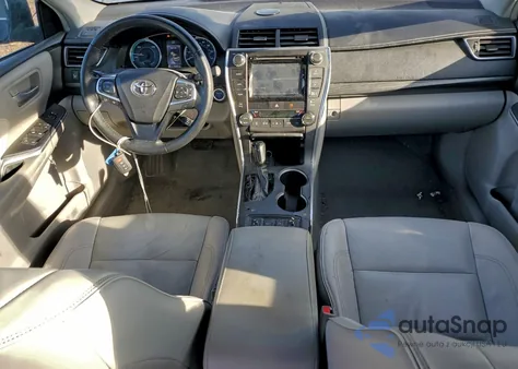 2015 Toyota Camry Hybrid z USA, uszkodzony, nr VIN 4T1BD1FK0FU157228